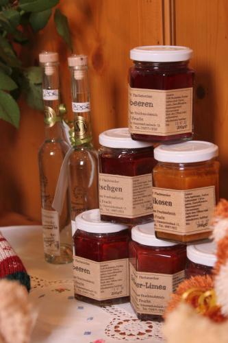 a group of jars of honey sitting on a table at Hotel Goldenes Fass in Rothenburg ob der Tauber in Rothenburg ob der Tauber