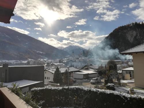 a view of a town with mountains in the background at Ferienwohnung Pupeter in Arzl im Pitztal