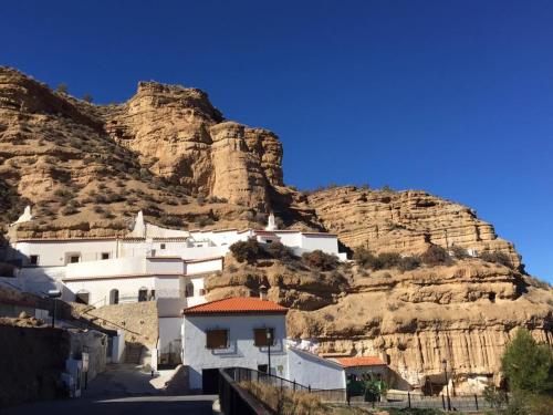 a village on the side of a mountain at Hotel Balneario de Graena in Graena
