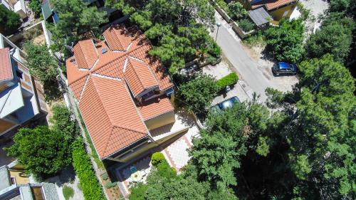 an overhead view of a house with an orange roof at Apartments Emma in Mali Lošinj