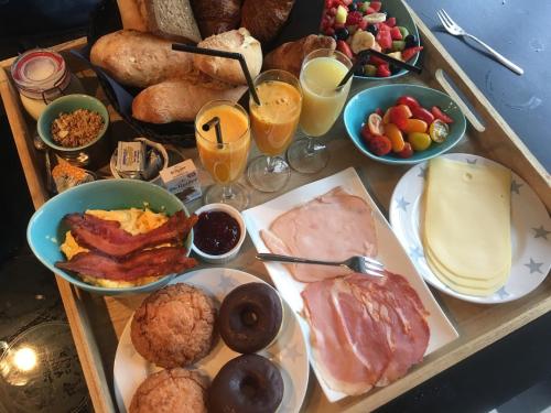 a table with many different types of breakfast foods at Silver Moon Bed & Breakfast in Voorschoten