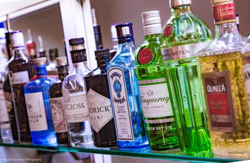 a shelf filled with lots of bottles of alcohol at The Norseman Temple Bar in Dublin