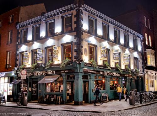a building on the corner of a street at night at The Norseman Temple Bar in Dublin