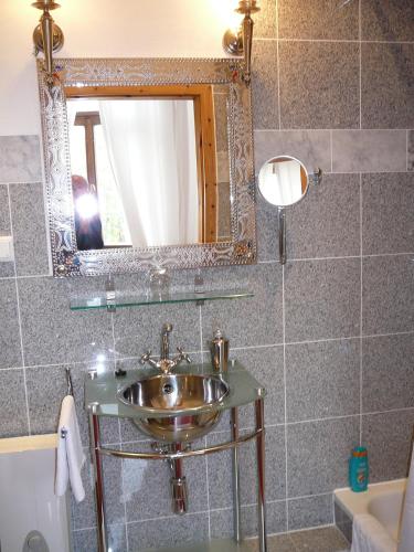 a bathroom with a sink and a mirror at Hotel-Park-Residenz in Aschersleben