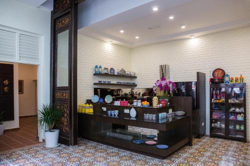 a room with a counter with some products in it at Aava Malacca Hotel in Melaka