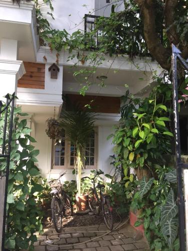 a couple of bikes parked outside of a house at Nathans Holiday Home in Cochin
