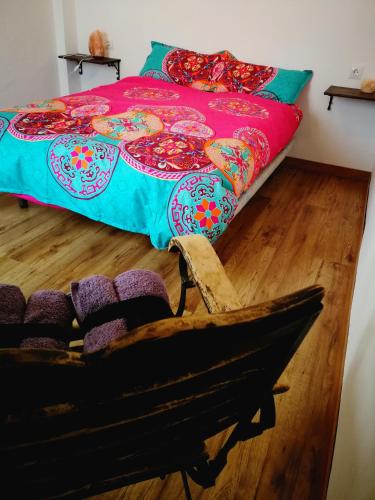 a bedroom with a bed and a wooden floor at Ca' Vaschino in Granada