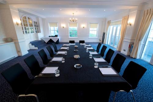 a large conference room with a long table and chairs at Hythe Imperial Hotel, Spa & Golf in Hythe