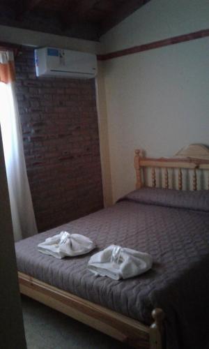 Katil atau katil-katil dalam bilik di Principado Sierras Hotel