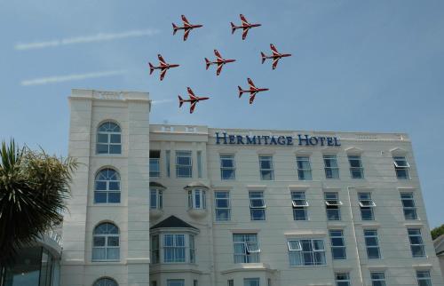 a number of planes flying in the sky at The Hermitage Hotel - OCEANA COLLECTION in Bournemouth