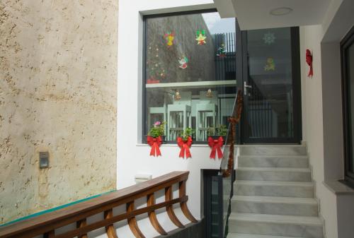 a staircase with christmas decorations in a window at La Pasajera Hostal Boutique in Conil de la Frontera
