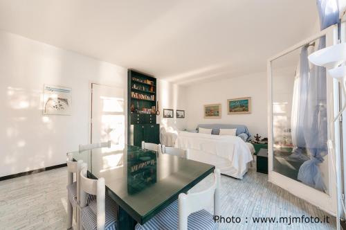 a living room with a table and a bed at Cinqueterre National Park Sea view in Framura