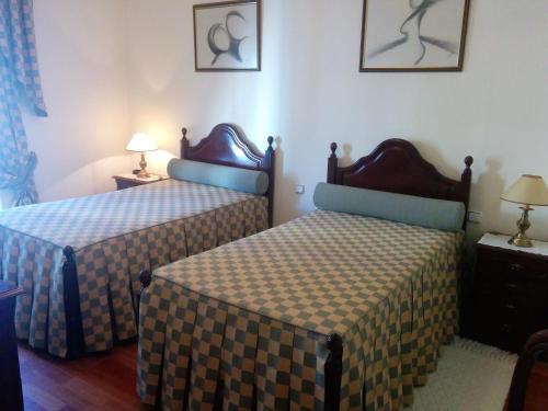 A bed or beds in a room at Hospedaria A Varanda