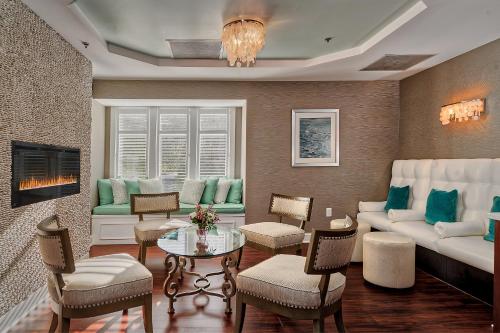a living room with a couch and a table at Water's Edge Resort & Spa in Westbrook