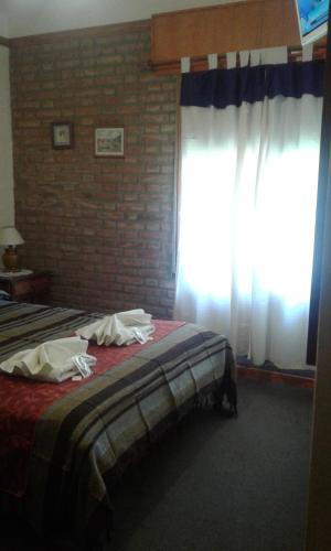 Katil atau katil-katil dalam bilik di Principado Sierras Hotel