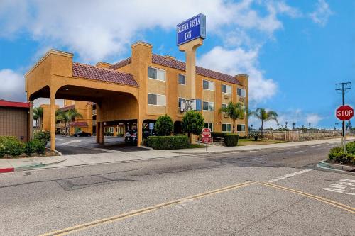 a sign for a hotel on the side of a street at Buena Vista Inn in Anaheim