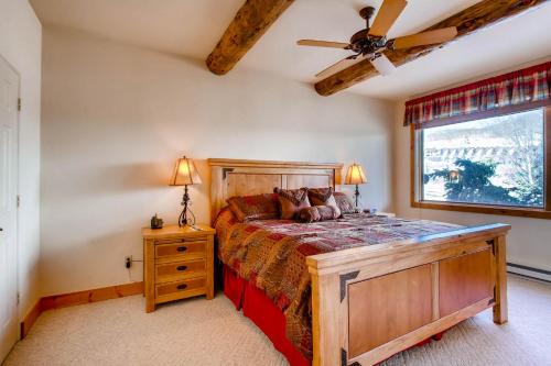 a bedroom with a bed and a ceiling fan at The Plaza Condominiums by Crested Butte Mountain Resort in Mount Crested Butte