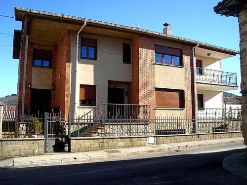 a building on the side of a street at La Loma in Boñar