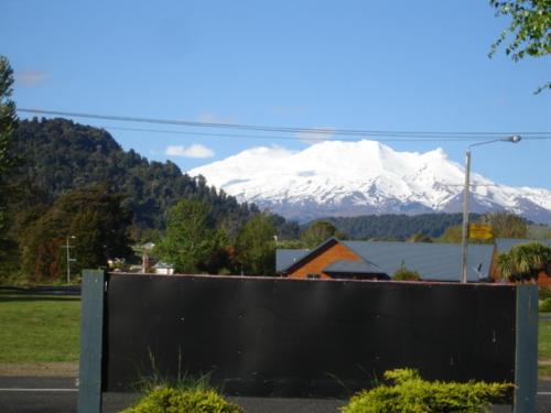 a view of a snow covered mountain in the distance at Ohakune Court Motel in Ohakune
