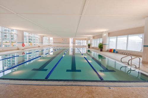 a large swimming pool in a building at Pinnacle Hotel at the Pier in North Vancouver