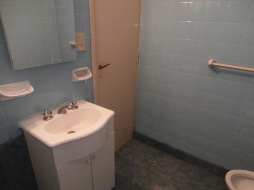 a bathroom with a sink and a toilet at Hotel El Circulo in Mar del Plata