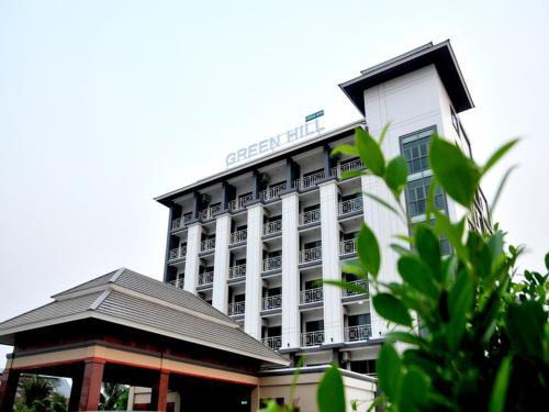 a large building with a hotel in front of it at Green Hill Hotel Phayao in Phayao
