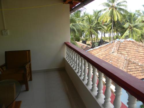 Un balcón o terraza de Maria Paulo Guest House Bar and Restaurant