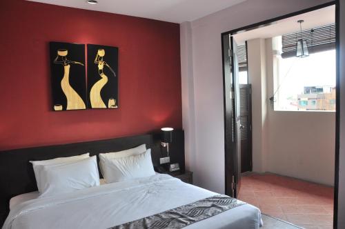 Ένα ή περισσότερα κρεβάτια σε δωμάτιο στο Kimberley Hotel Georgetown