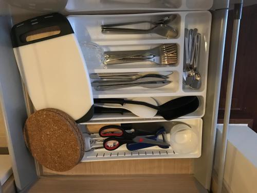 a refrigerator filled with lots of utensils at The palm wongamat pattaya in North Pattaya
