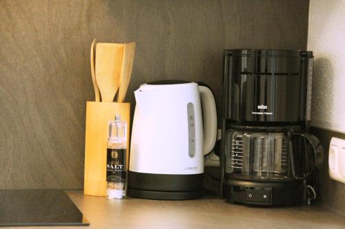 a coffeemaker sitting on a counter next to a coffee maker at Apartments Fuchs in Grundlsee