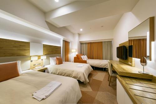 Un ou plusieurs lits dans un hébergement de l'établissement Sotetsu Fresa Inn Nagano-Zenkojiguchi