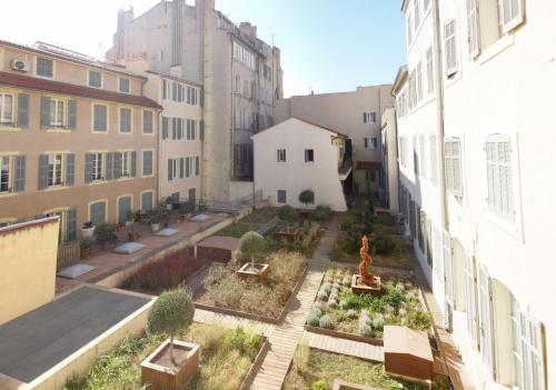an aerial view of a courtyard in a building at Sunny Studio Vieux Port in Marseille