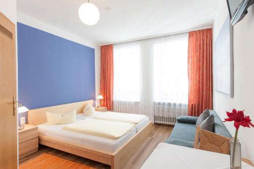 Säng eller sängar i ett rum på Hotel Pension am Hauptbahnhof