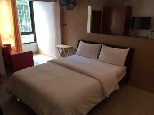 Llit o llits en una habitació de Chanmuan Resident
