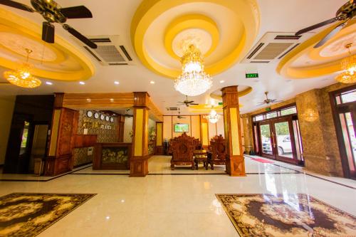 a lobby of a building with a chandelier at Mai Anh Hotel in Lao Cai