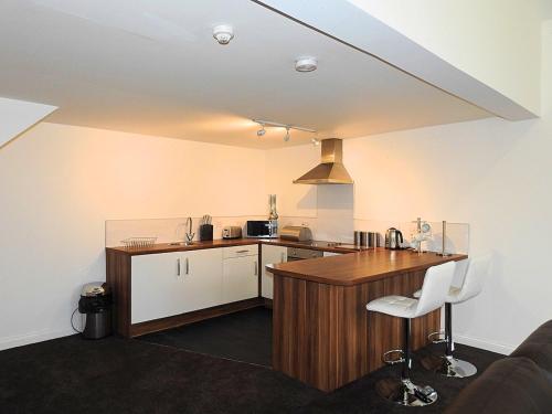 a kitchen with a table and a counter top at Parks Nest 3 in Hull