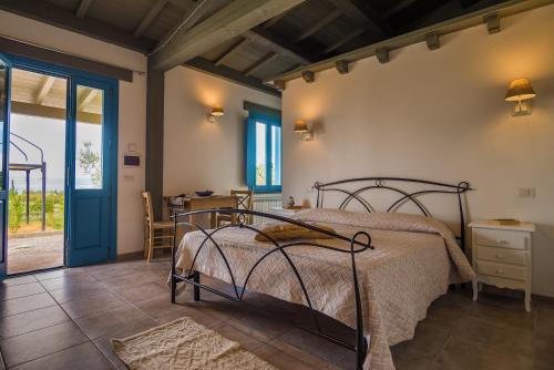 a bedroom with a bed and a table and chairs at Agriturismo Parco di Canuleio in Bolsena