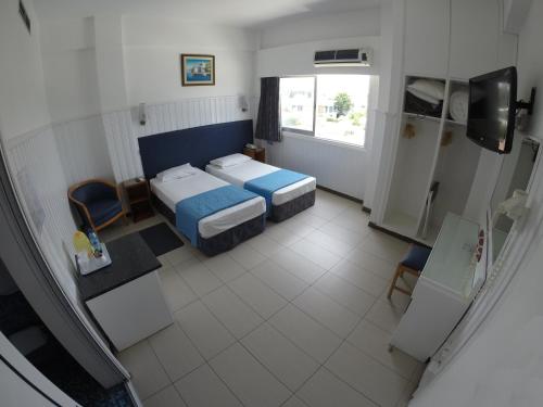 Postel nebo postele na pokoji v ubytování Asty Hotel