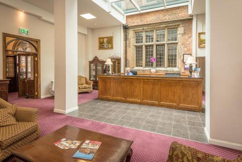a court room with a desk in the middle of it at Castle Bromwich Hall; Sure Hotel Collection by Best Western in Birmingham