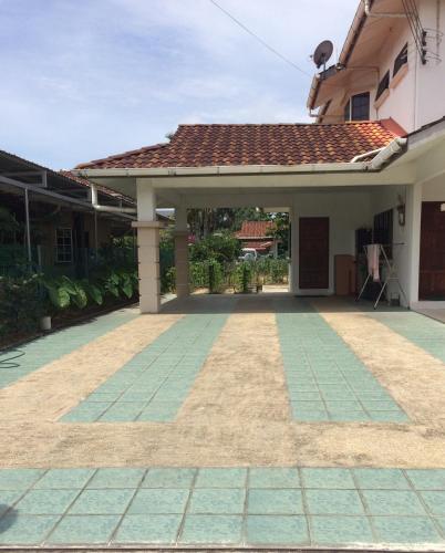 a view of a house with a patio at Golden Swan Sibu Homestay in Sibu