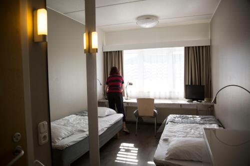 Postel nebo postele na pokoji v ubytování Finlandia Hotel Alba