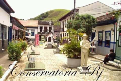 a statue of a man in the middle of a street at Pousada Preludio in Conservatória