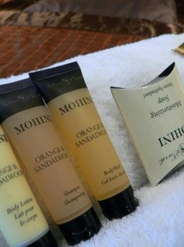 a group of three products sitting on a pile of towels at Rustenburg Boutique Hotel in Rustenburg