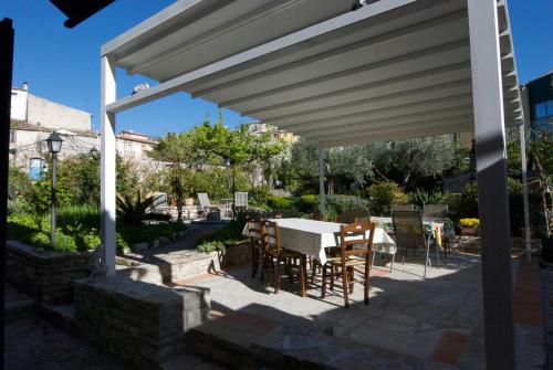 a patio with a table and chairs under a pavilion at Art & Breakfast in Ripabottoni