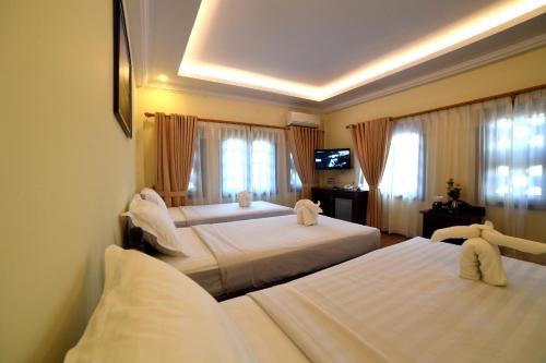Säng eller sängar i ett rum på Bagan View Hotel