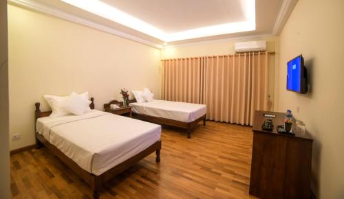 Letto o letti in una camera di Bagan View Hotel
