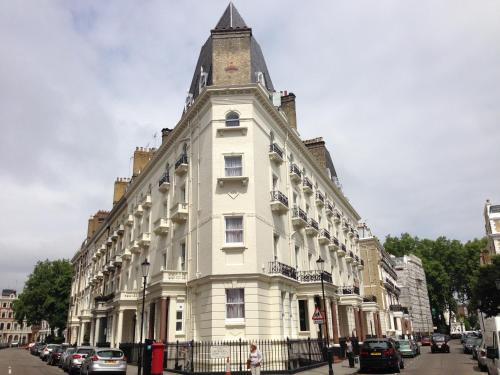a large white building with a tower on top of it at Belvedere House (Gloucester Road) in London