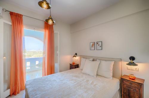 Ένα ή περισσότερα κρεβάτια σε δωμάτιο στο Aerides Villas