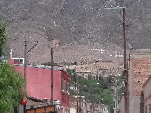 a view of a hill with a mountain in the background at Casa Suyay in Tilcara