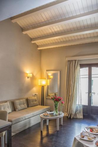 a living room with a couch and a table at Grand Hotel Villa Itria Congress & Spa in Viagrande